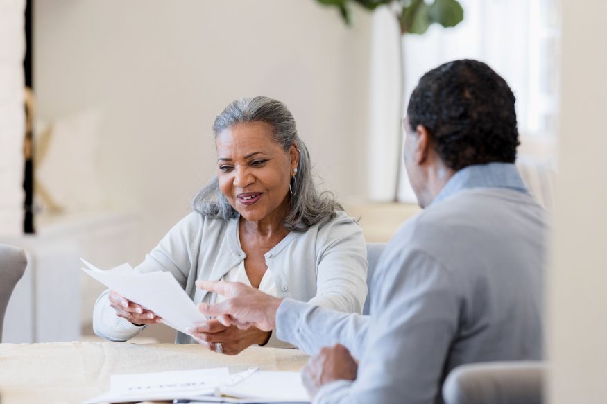 People discussing an insurance policy